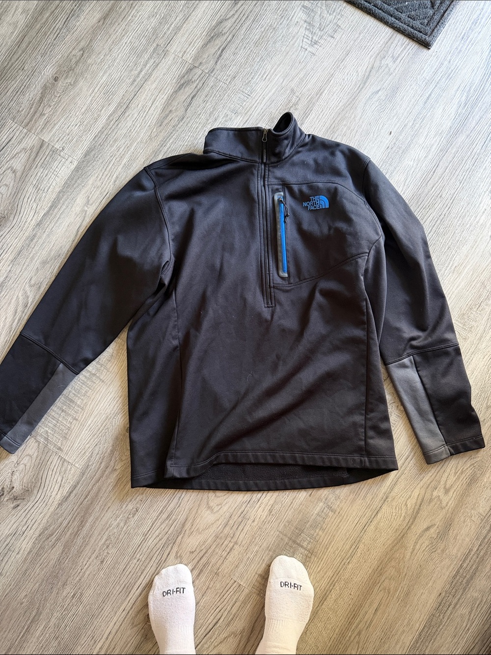 The North Face Black Half-Zip Pullover with Blue Chest Zip